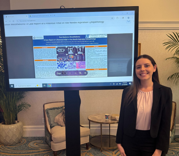 Dr. Kaylee Boschett-Santana showcasing her postdoctoral research poster at the Florida Society of Pathologists Annual Meeting.